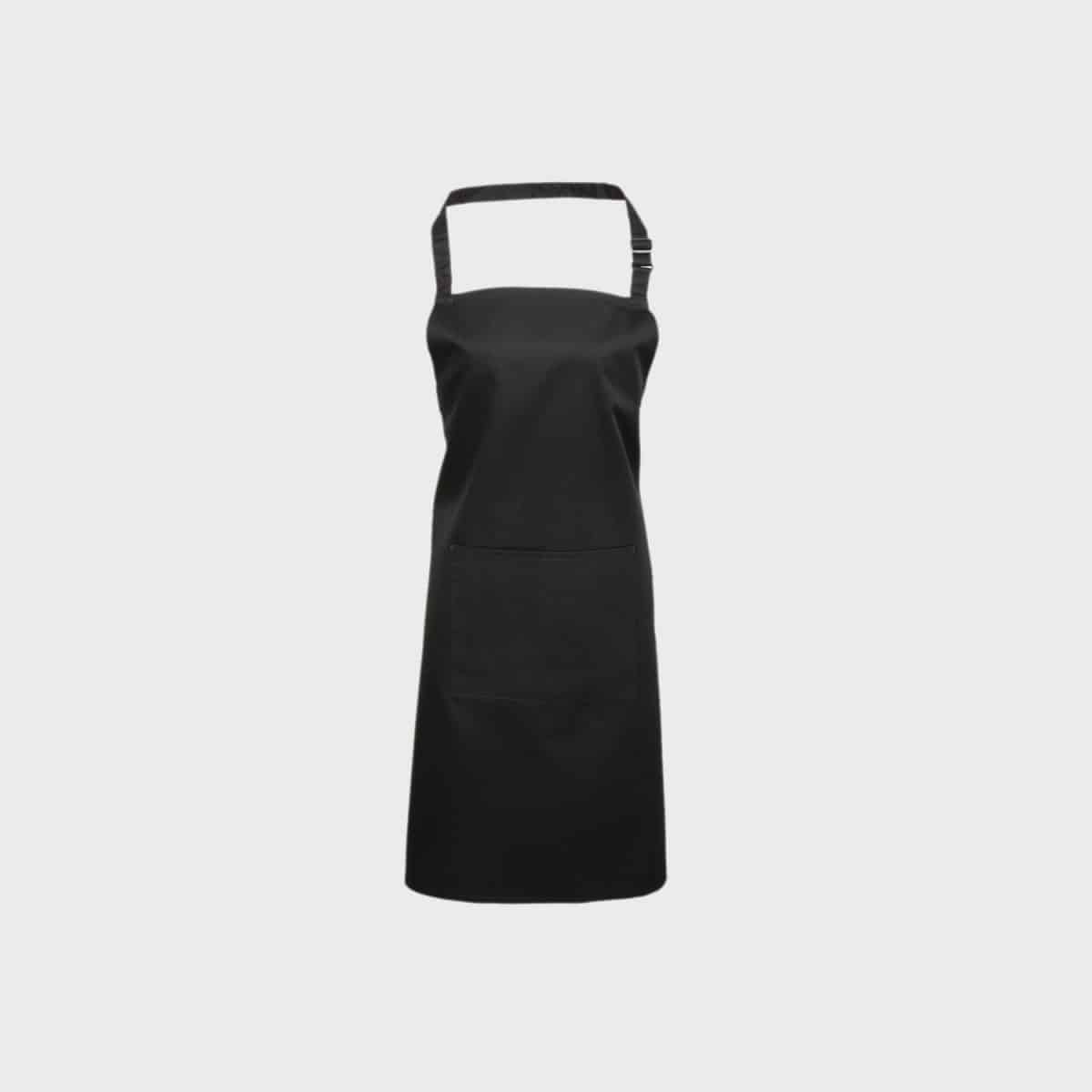 A PREMIER WORKWEAR bib apron with pocket in black with adjustable neck strap and front pocket on a plain white background. The apron has a simple and classic design and is therefore ideal for use in the kitchen or workshop.